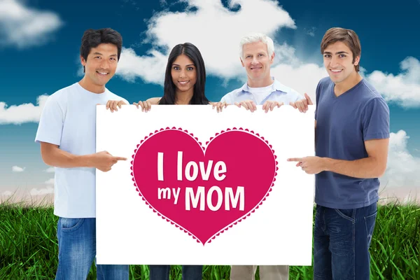 People in jeans showing a big sign — Stock Photo, Image