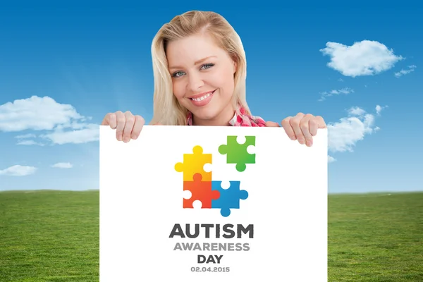 Woman beaming while holding a blank sign — Stock Photo, Image