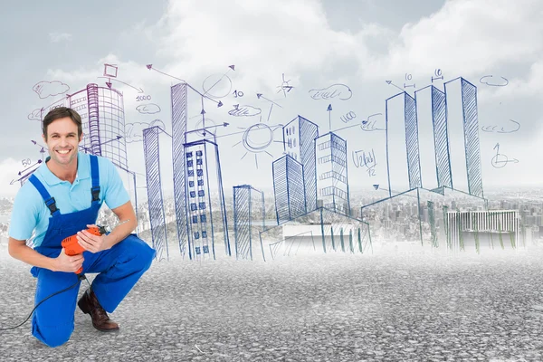 Happy carpenter holding drill machine — Stock Photo, Image