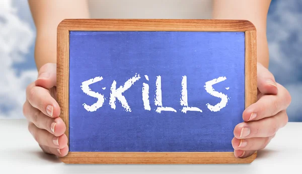 Skills and hands showing chalkboard — Stock Photo, Image