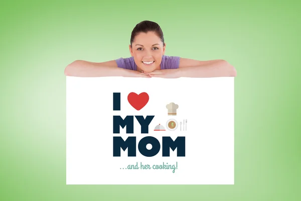 Good looking woman posing behind a billboard — Stock Photo, Image