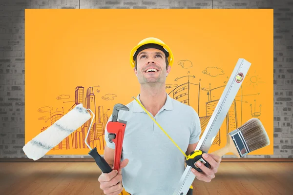 Worker holding various equipment — Stock Photo, Image