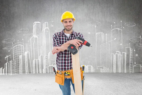 Male carpenter with drill machine and plank — Stock Photo, Image