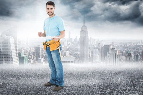 Construction worker holding clipbard — Stock Photo, Image