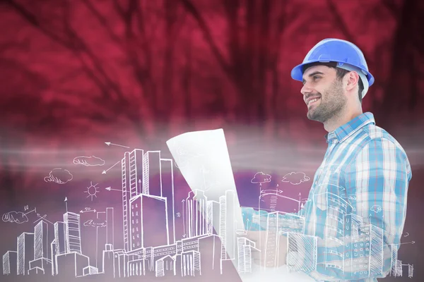 Smiling engineer holding blueprint — Stock Photo, Image