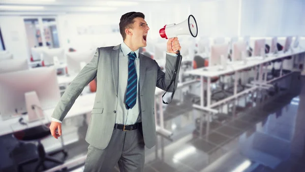 Composite image of businessman with megaphone — Stock Photo, Image