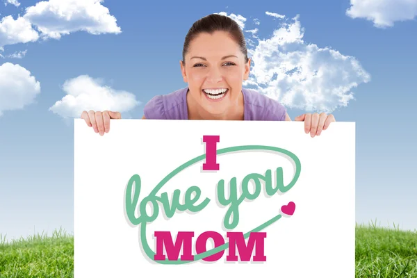 Woman posing behind a billboard — Stock Photo, Image