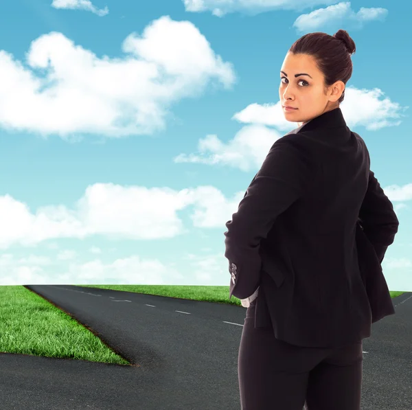 Composite image of serious businesswoman — Stock Photo, Image