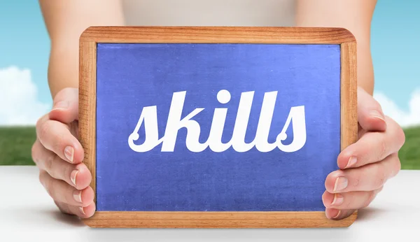 Skills and hands showing chalkboard — Stock Photo, Image