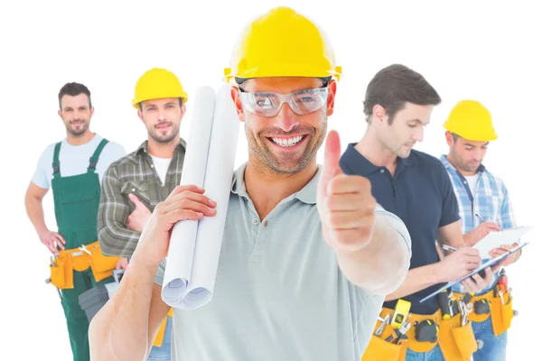 Smiling architect with plan — Stock Photo, Image