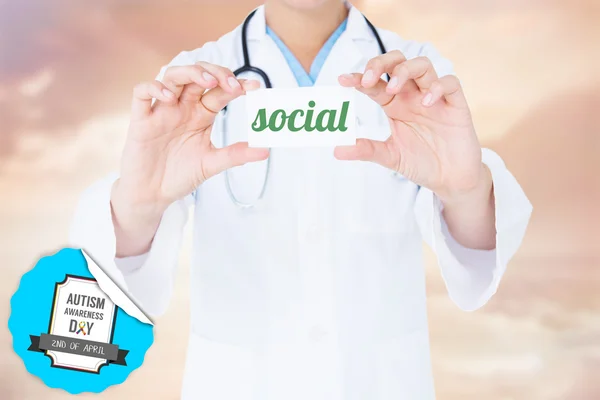 Словосочетание social and doctor holding card — стоковое фото