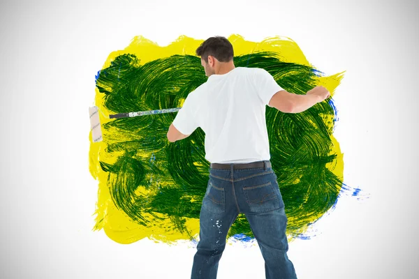 Man using paint roller — Stock Photo, Image