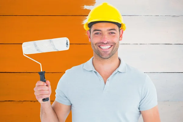 Portrait of manual worker holding paint roller — Stock Photo, Image