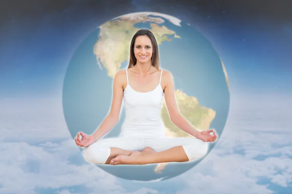 Toned woman in lotus pose at fitness studio — Stock Photo, Image