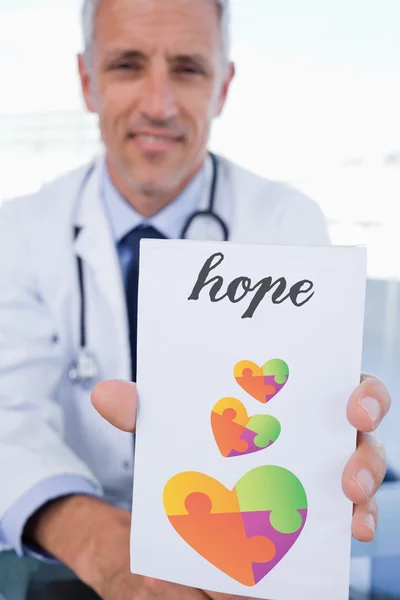 Doctor showing blank prescription sheet — Stock Photo, Image