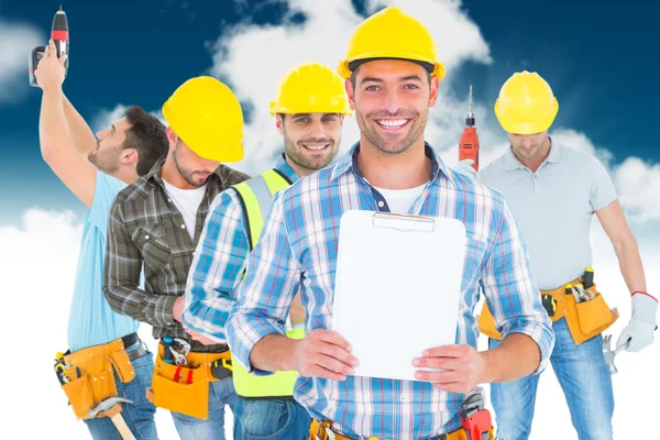Smiling manual worker holding clipboard — Stock Photo, Image