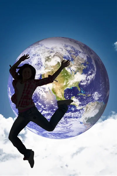 Casual brunette jumping and smiling — Stock Photo, Image