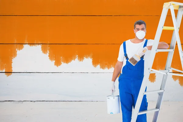 Handyman with paintbrush and can — Stock Photo, Image