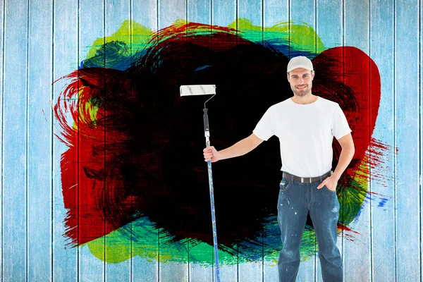 Man holding paint roller on white background — Stock Photo, Image