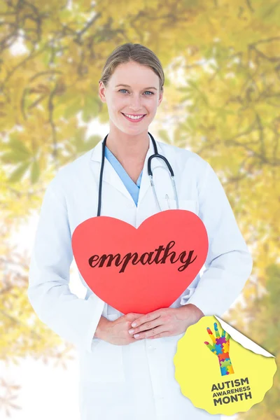 Palabra empatía y tarjeta de tenencia médico — Foto de Stock