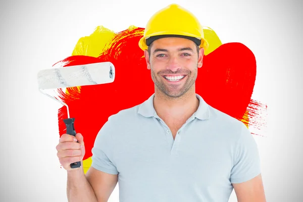 Manual worker holding paint roller — Stock Photo, Image