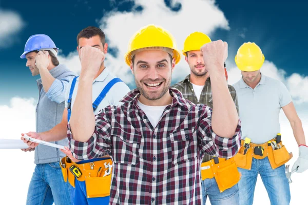 Successful male handyman clenching fists — Stock Photo, Image