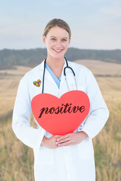 Palabra positiva y tarjeta de retención del médico — Foto de Stock