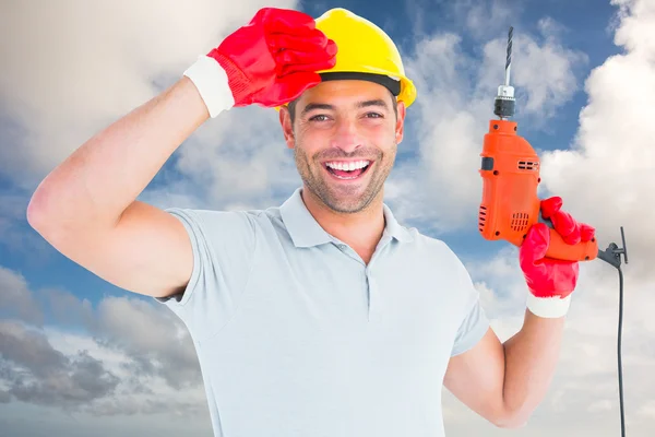 Manual worker holding drill machine — Stock Photo, Image