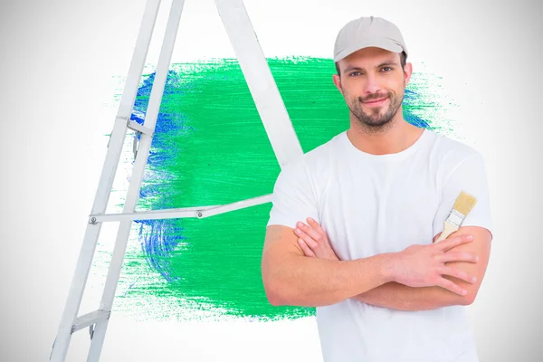 Handyman with paintbrush and ladder — Stock Photo, Image