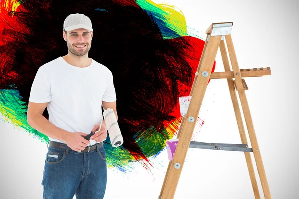 Man holding paint roller — Stock Photo, Image