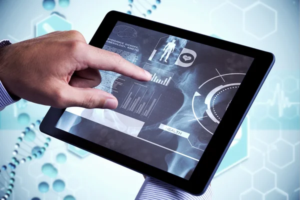 Composite image of man using tablet pc — Stock Photo, Image