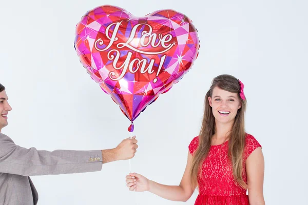 Hipster offering balloon to his girlfriend — Stock Photo, Image