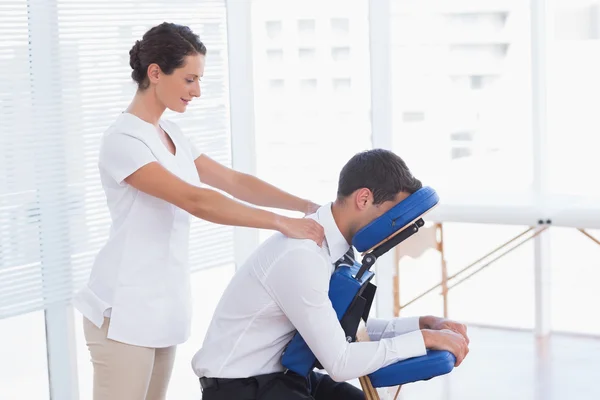 Businessman having back massage — Stock Photo, Image