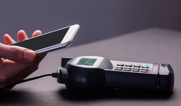 Man using smartphone to express pay — Stock Photo, Image