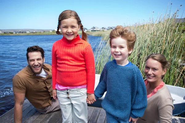 Happy family at a lake — Stock Photo, Image