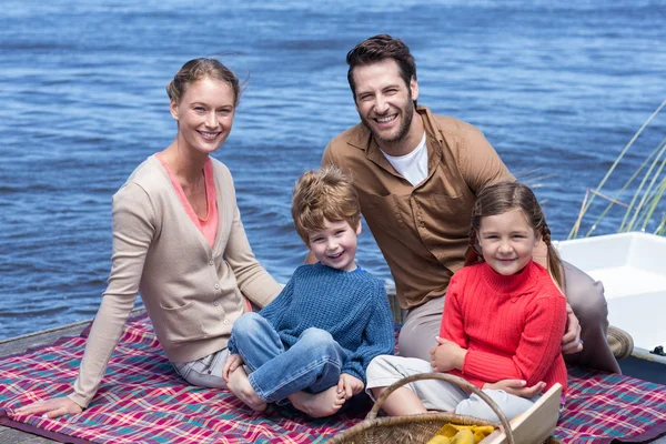 Happy family having picnic at a lake — Stock Photo, Image