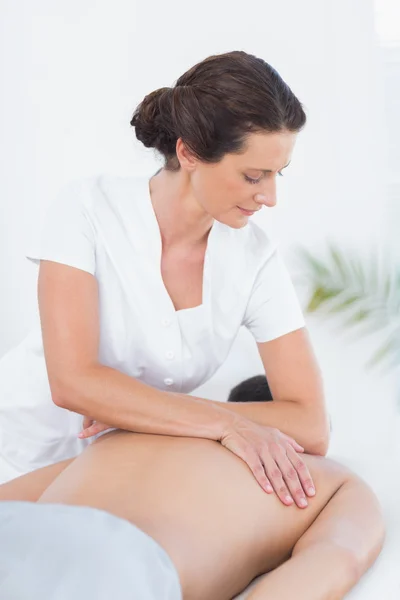 Physiotherapist doing back massage to her patient — Stock Photo, Image
