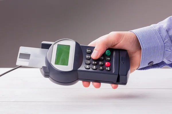 Man entering his pin on terminal — Stock Photo, Image