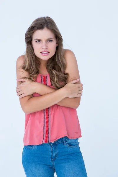 Shivering woman holding her arms — Stock Photo, Image