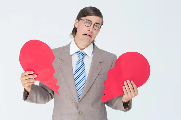 Geeky businessman holding broken heart — Stock Photo, Image