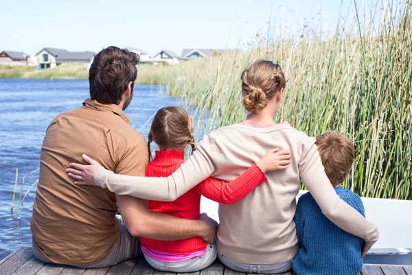 Happy family at a lake — Stock Photo, Image