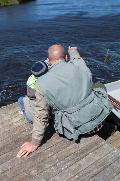 Happy man sitting with his son — Stock Photo, Image