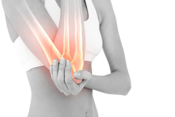 Highlighted elbow pain of woman — Stock Photo, Image