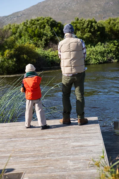 Happy man fishing with his son — Stock Photo, Image