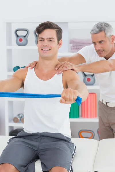 Doctor examining his patient back — Stock Photo, Image