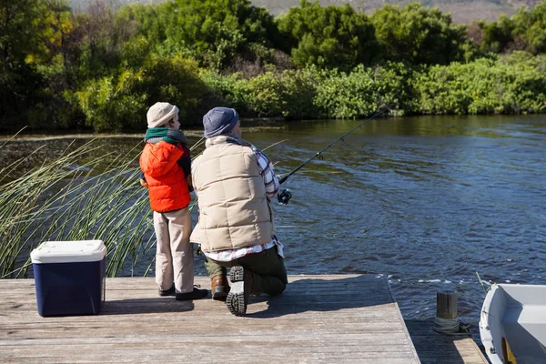 Happy man fishing with his son — Stock Photo, Image