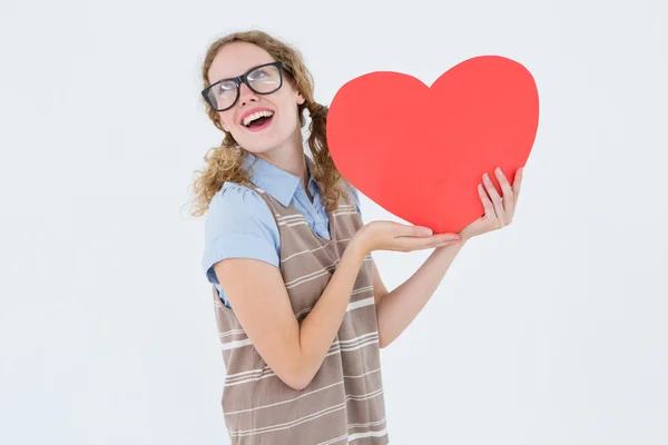 Geeky hipster woman holding heart card — Stock Photo, Image