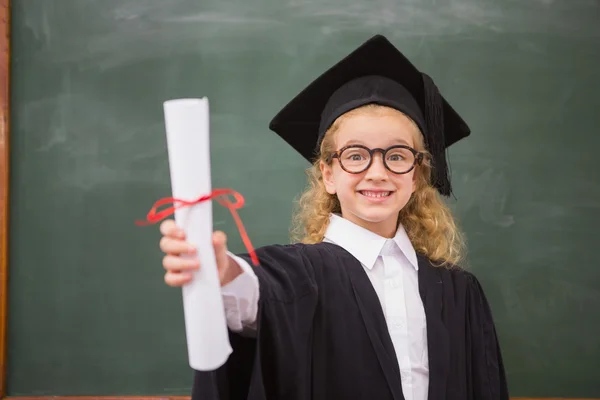 Pupil with graduation robe and holding her diploma — Stock Photo, Image