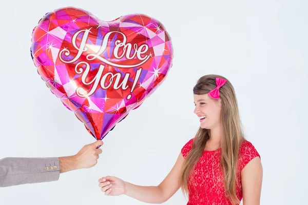 Hipster offering balloon to his girlfriend — Stock Photo, Image