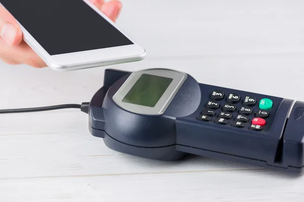 Man using smartphone to express pay — Stock Photo, Image